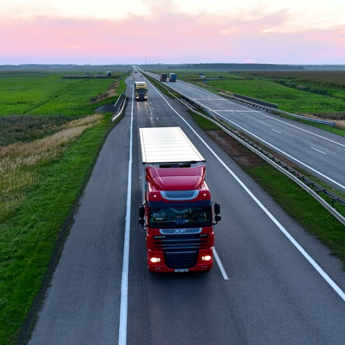 Men Standing on the Deck of a Cargo Ship 